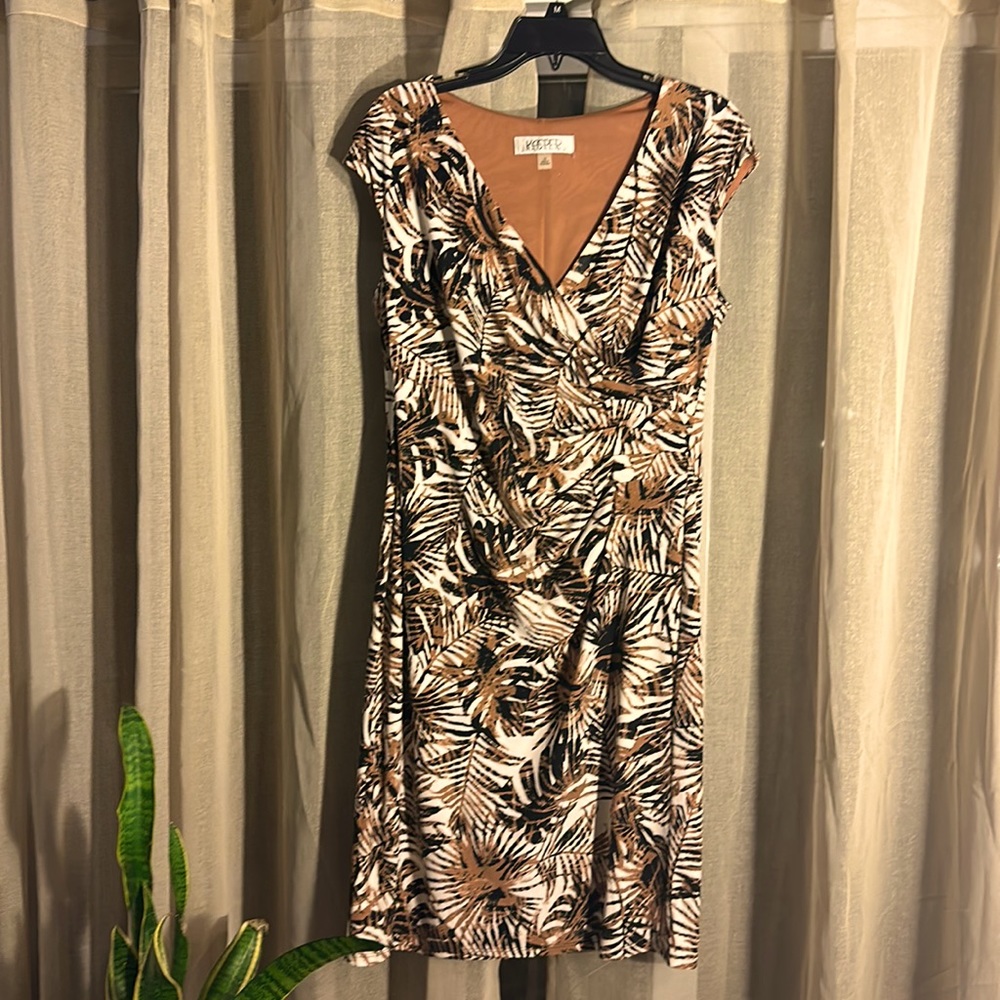 Beautiful knee length dress .